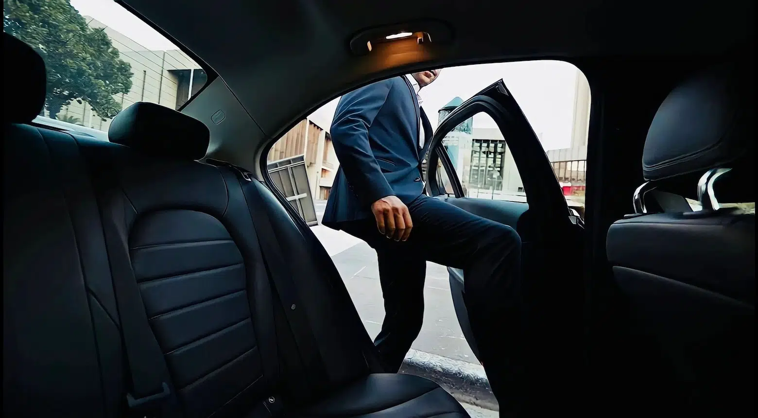 Chauffeur opening the car door for an executive client in Oak Brook, IL