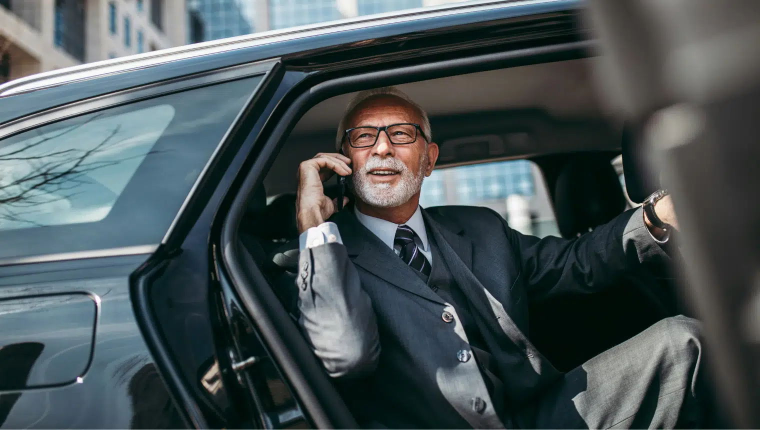 Professional chauffeur providing corporate transportation